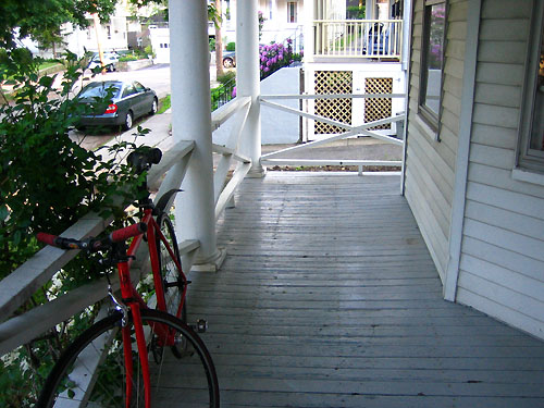 Our porch and a really cool bike.JPG